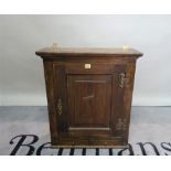 An 18th century and later oak hanging cupboard, 63cm wide x 72cm high, and another similar,