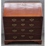 A George III mahogany bureau, the fitted interior over four long graduated drawers on bracket feet,
