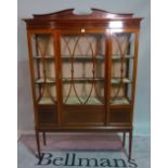 An Edwardian inlaid mahogany display cabinet, on tapering square supports, 122cm wide x 180cm high.