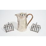 A pair of silver toastracks, each of five bar form, with a loop handle, London 1932,