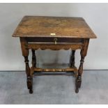 An 18th century oak single drawer side table on turned supports, united by 'H' frame stretcher,