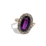 An amethyst and diamond-set dress ring Of oval cluster design,