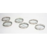 A set of six Sterling silver mounted glass coasters,