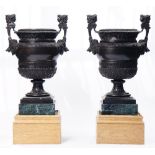 After Claude Ballin, a pair of bronze urns, each with twin-headed Janus handles,