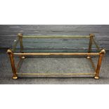 A 20th century lacquered brass and glass rectangular coffee table, on octagonal supports,