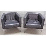 A pair of retro design black leather upholstered square back armchairs, on tubular chrome supports,