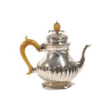 A Dutch silver teapot, of baluster form, with partly spiral fluted decoration,