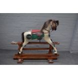 Haddon Rockers, a wooden painted rocking horse, with dapple grey body, on a stained pine base,
