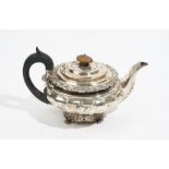 A George IV silver teapot, by Charles Price, London 1825, of fluted compressed circular form,