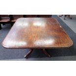 A late George III mahogany rectangular snap top breakfast table on four scroll supports,