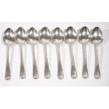 Eight late Victorian Scottish silver single struck feather edged Old English pattern dessert spoons,