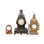 A Victorian Continental gilt brass mantel clock of lantern form, with acanthus moulded finial,