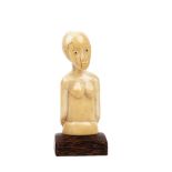 An African ivory torso of a woman, 19th century, 14cm high with a wooden stand.