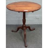 A George III fruitwood tripod occasional table, with circular snap top, 60cm diameter x 69cm high.