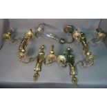 A set of four 19th century brass twin branch wall lights, 31cm wide x 40cm high.