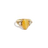 A cat's eye quartz and diamond-set dress ring, to oval cabochon cat's eye quartz,