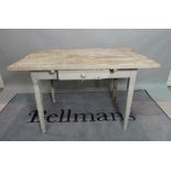 An early 20th century French pine single drawer kitchen table, on tapering square supports,