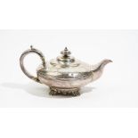 A George IV silver teapot, of compressed circular form, the body decorated with a reeded band,