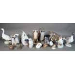 A group of Royal Copenhagen porcelain figurines, mainly models of animals.