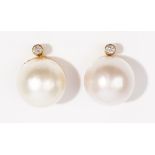 A pair of diamond and mabé cultured pearl-set earclips The collet-set diamonds, above mabé pearls,