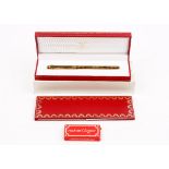A Must de Cartier gold plated fountain pen, cased, with guarantee card and booklet.