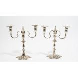 A pair of George II style cast silver twin light table candelabrum, by J B Chatterley & Sons,