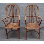 A pair of ash and elm Windsor elbow chairs, 19th century, the high backs with pierced splats,