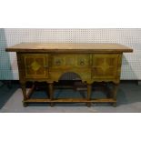 A modern oak and marble inlaid sideboard, with single frieze drawers flanked by cupboards,