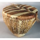 An early 20th century zebra upholstered African circular drum, 39cm diameter x 40cm high.