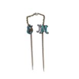 Two diamond set and pale blue enamelled stick pins, one designed as the initial 'E',