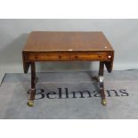 A late George III mahogany and rosewood banded two drawer drop flap sofa table,