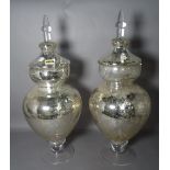 A pair of modern decorative silvered glass lidded vases, 61cm tall (2).