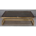 A rectangular smoked glass and lacquered brass coffee table, on geometric box frame,