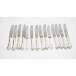 Twelve German steel bladed table knives,