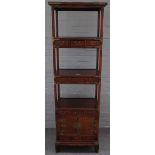 A 20th century Chinese elm side cabinet / what-not, with three open tiers,