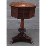 A Regency rosewood octagonal teapoy, with four canister interior on carved column on three paw feet,