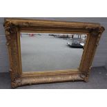 A Victorian style deep framed gilt framed mirror, with shell moulded corners,