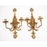A pair of North European style giltwood twin branch wall sconces, each formed as an Egyptian figure,