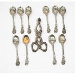 Ten cast leaf form teaspoons, apparently unmarked,