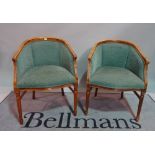 A pair of Louis XVI style stained beech tub chairs, on fluted tapering supports,