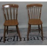 A set of four brown painted stickback dining chairs, 36cm wide x 80cm high, (4).