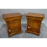 A pair of reproduction Biedermeier style bedside cabinets, with a drawer and cupboard under,