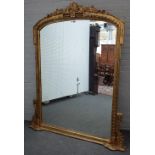 A Victorian style gilt framed arch top overmantel mirror with acanthus scroll crest,