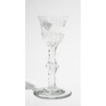 An engraved facet stemmed wine glass, 1780's,