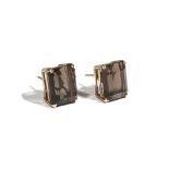 A pair of gold and smoky quartz-set earstuds, the rectangular cut-cornered step cut smoky quartz,