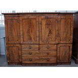 An early Victorian mahogany breakfront compactum wardrobe, on plinth base, 235cm wide x 178cm high.