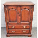 A small 17th century style oak side cupboard, by Titchmarsh & Goodwin,