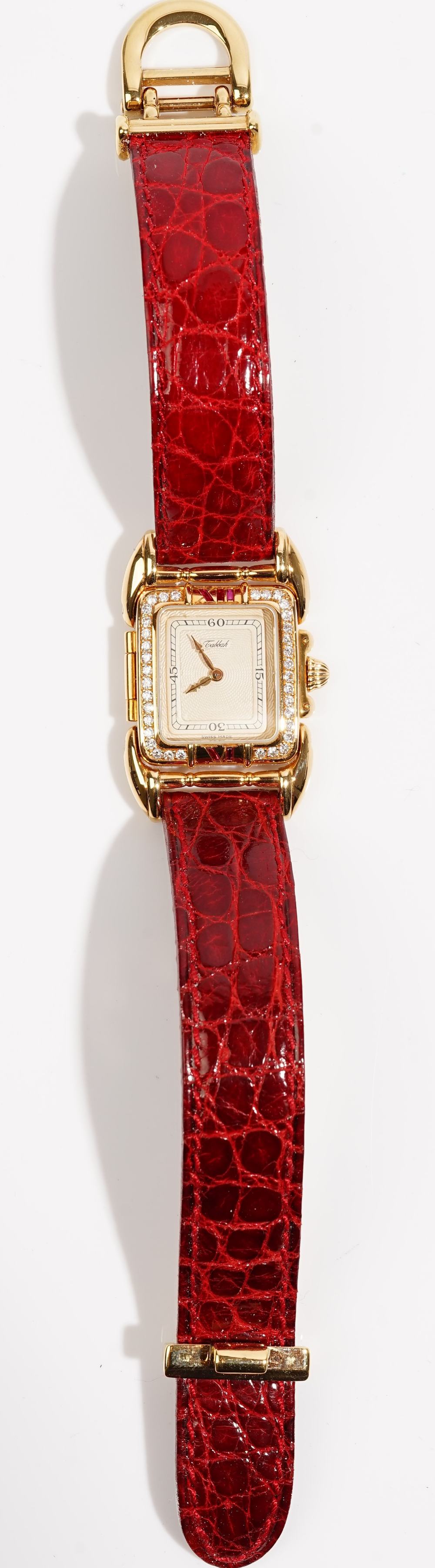 A Tabbah gold and diamond set rectangular cased lady's dress wristwatch,