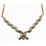 A gold and diamond necklace, the front in a ribbon twist design,