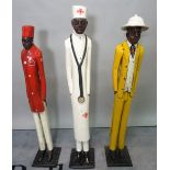 A group of three painted hardwood figures, the tallest 119cm high.